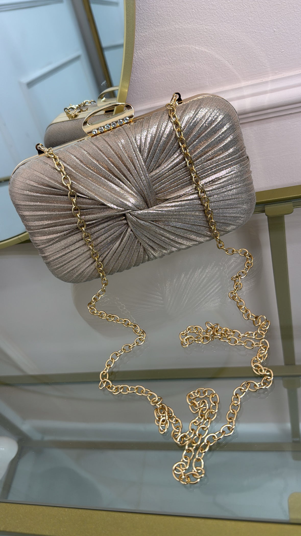 ISLA rose gold twist clutch bag