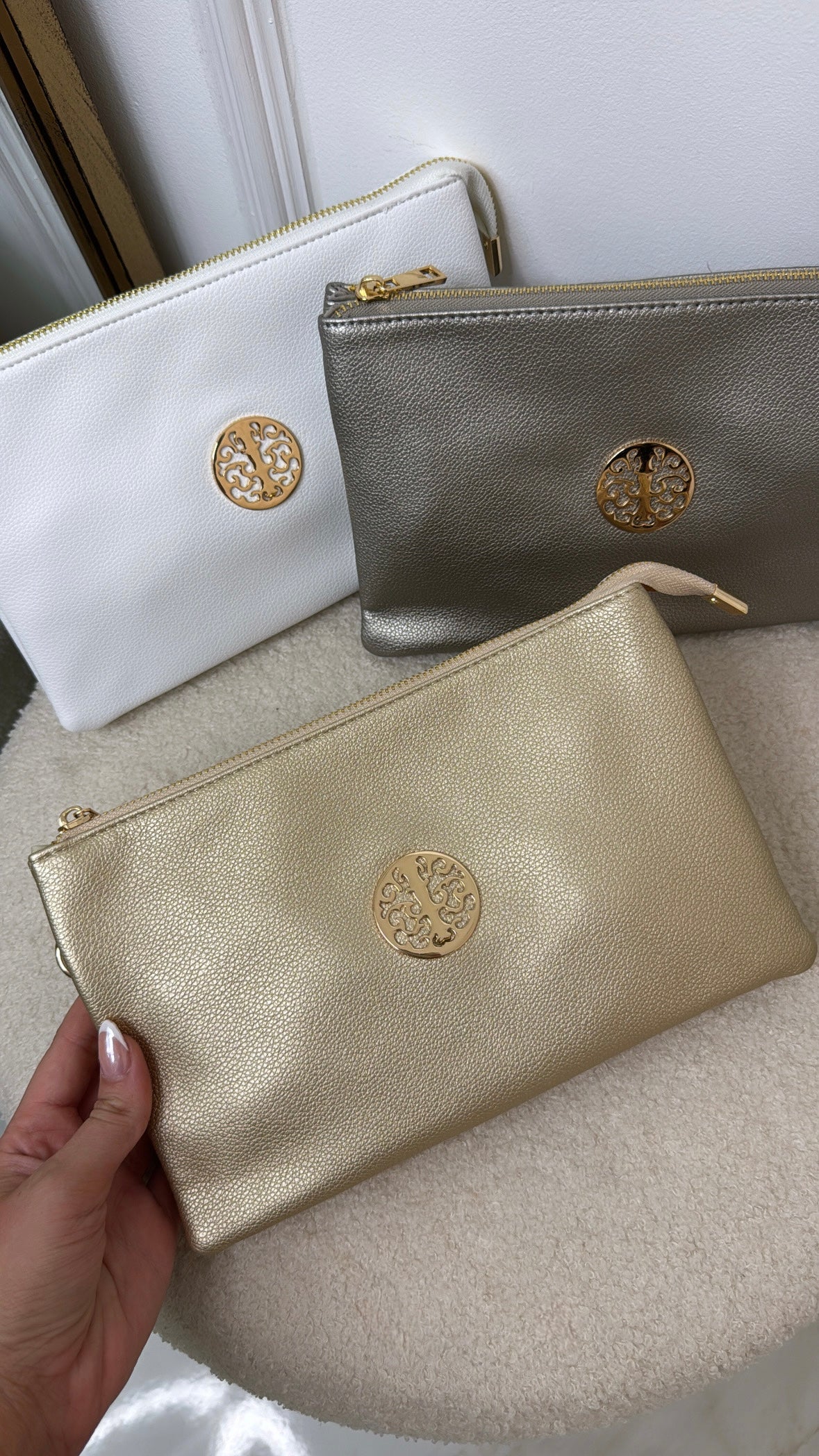 GIANA gold motif clutch bag