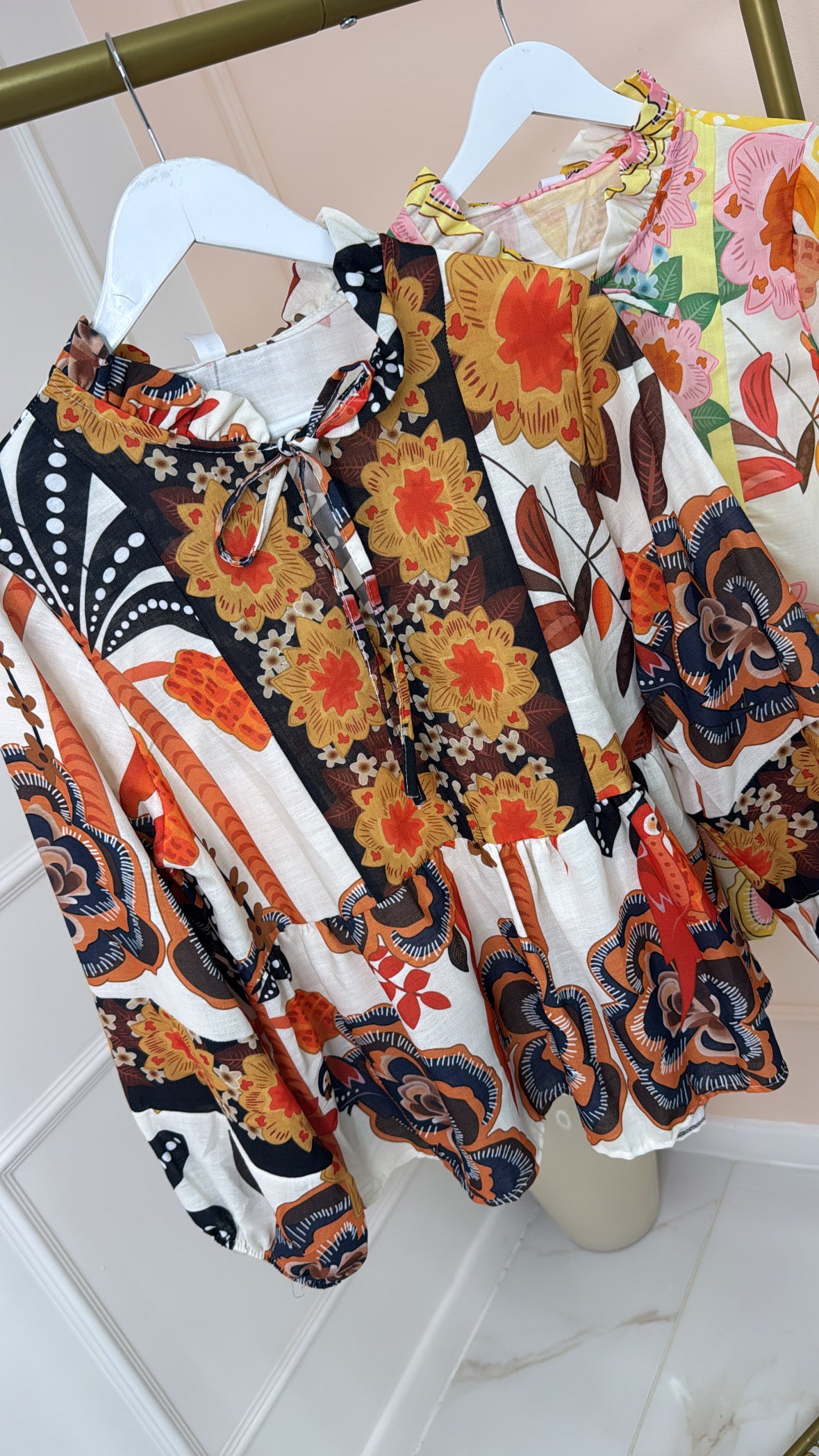 SADIE black floral tiered blouse