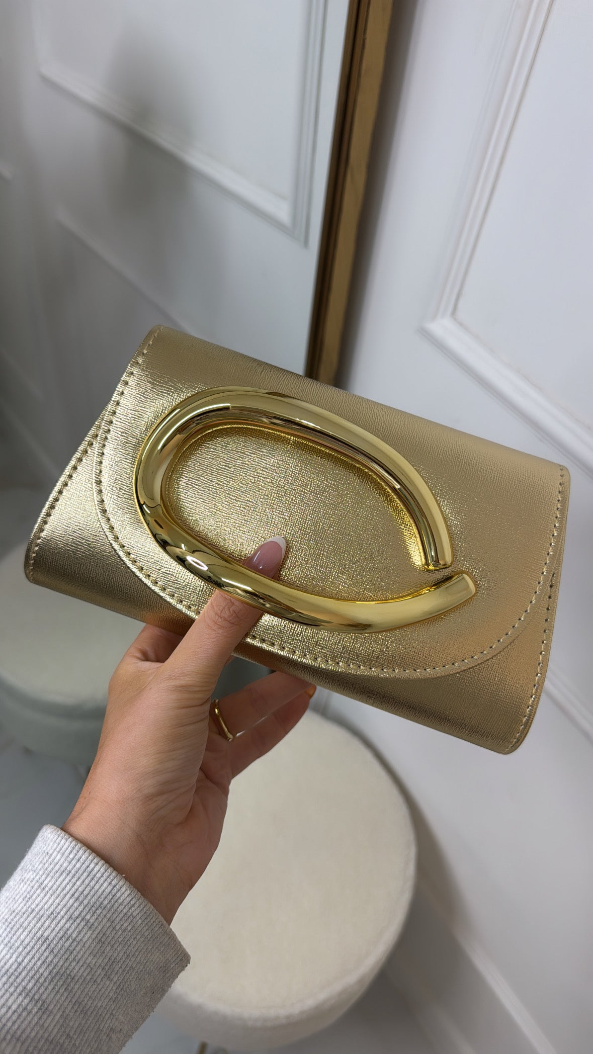 CLARISSA gold metallic clutch bag