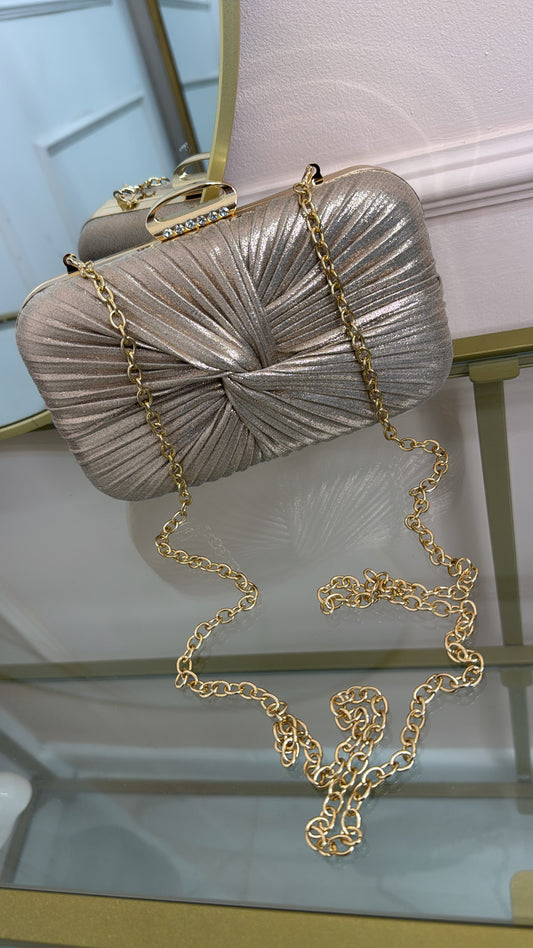 ISLA rose gold twist clutch bag