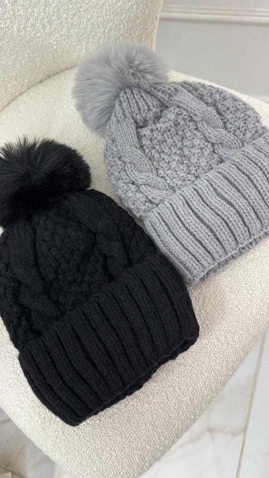 REMI black knit pom pom hat